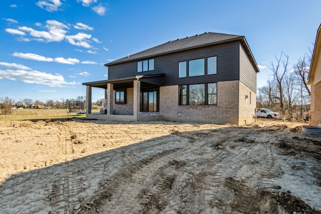 45070 Twin River Dr, Macomb, MI 48044 - back of property featuring brick siding