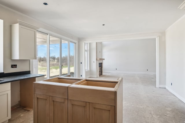 45070 Twin River Dr, Macomb, MI 48044 - kitchen with a fireplace, a sink, and baseboards