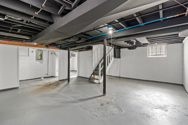 15748 Freeland St, Detroit, MI 48227 - basement with stairs, concrete block wall, and electric panel