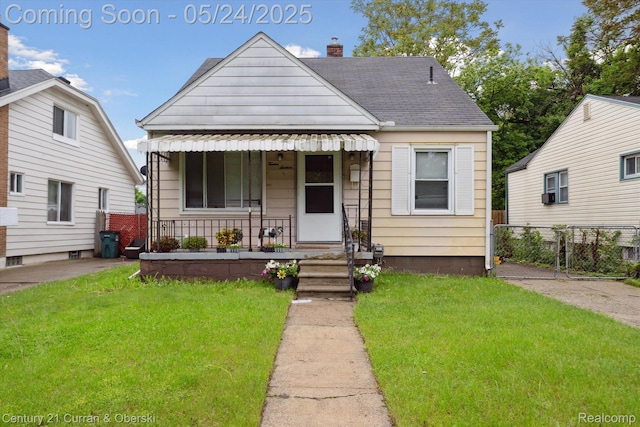 1216 E George Ave, Hazel Park, MI 48030 - view of front of property featuring a porch, a shingled roof, and a chimney