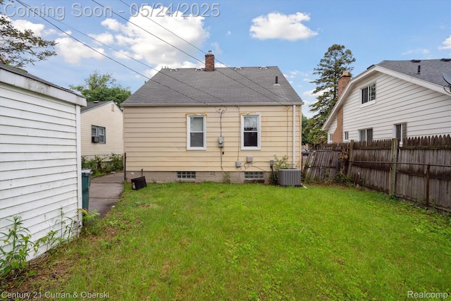 1216 E George Ave, Hazel Park, MI 48030 - rear view of house with a chimney, cooling unit, and a shingled roof