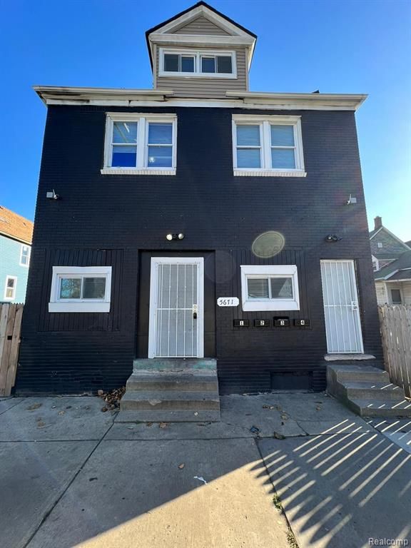 5671 Otis St, Detroit, MI 48210 - view of front facade with entry steps and fence