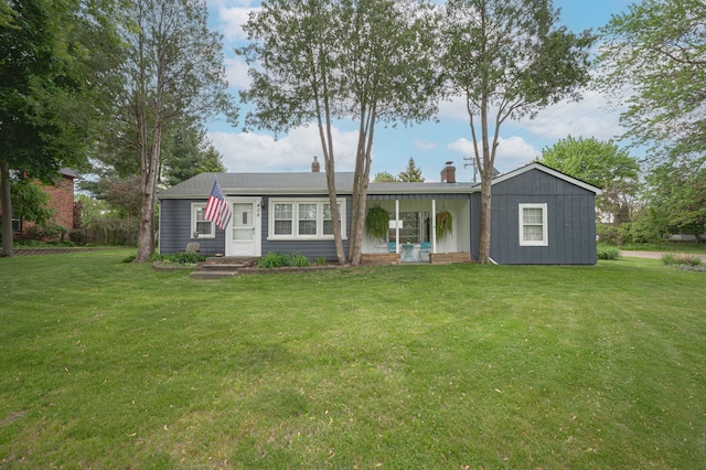 406 Common St, Walled Lake, MI 48390 - ranch-style house with a front lawn and a chimney