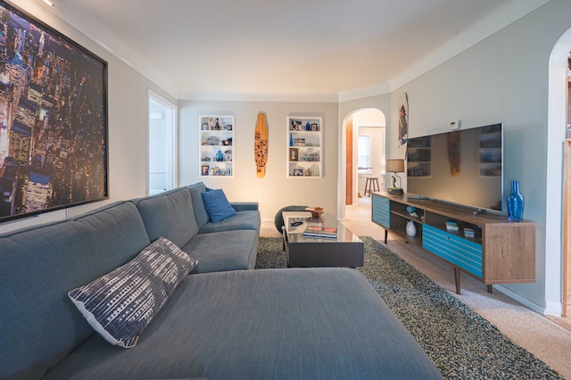 406 Common St, Walled Lake, MI 48390 - carpeted living room featuring arched walkways and baseboards