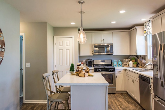 58204 Kincaid St, New Haven, MI 48048 - kitchen featuring stainless steel appliances, a sink, dark wood finished floors, light countertops, and recessed lighting