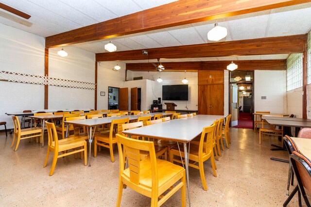 20800 Lefever Ave, Warren, MI 48091 - dining room featuring beamed ceiling and concrete block wall
