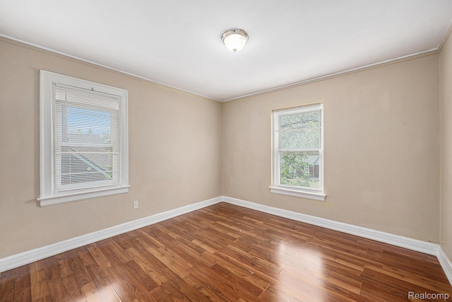 259 Navajo Ave, Pontiac, MI 48341 - unfurnished room featuring baseboards, wood finished floors, and ornamental molding