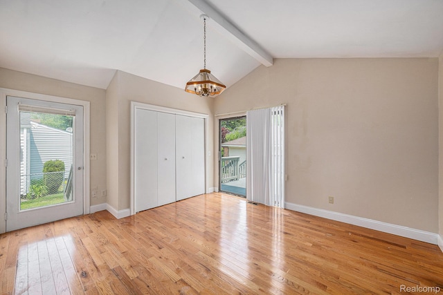 259 Navajo Ave, Pontiac, MI 48341 - unfurnished bedroom with a chandelier, multiple windows, baseboards, and access to exterior
