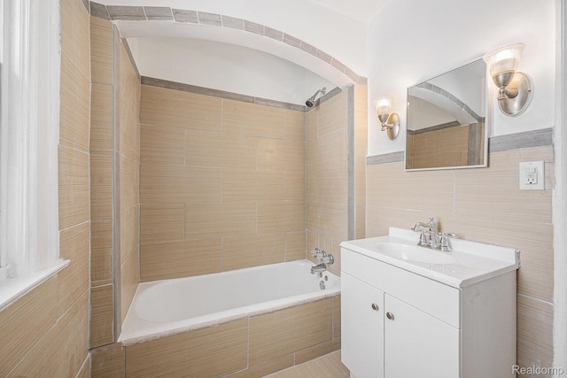 259 Navajo Ave, Pontiac, MI 48341 - bathroom featuring vanity, tile walls, and  shower combination