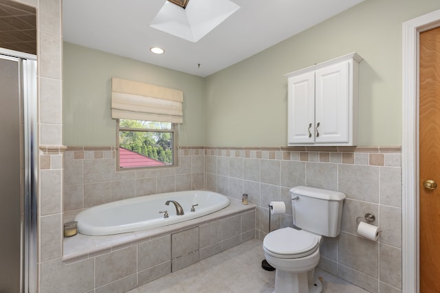 935 S Brys Dr, Grosse Pointe Woods, MI 48236 - bathroom featuring a skylight, tile patterned flooring, a bath, toilet, and an enclosed shower