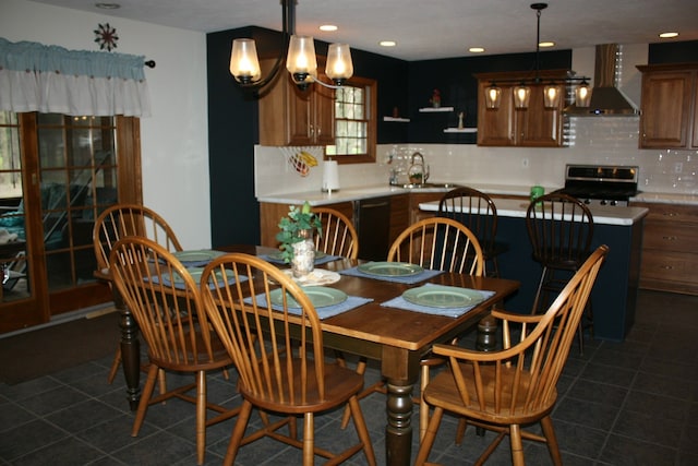 dining room featuring dark tile patterned flooring, a chandelier, and recessed lighting