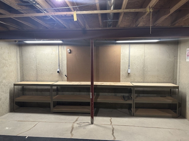 unfinished below grade area with a workshop area