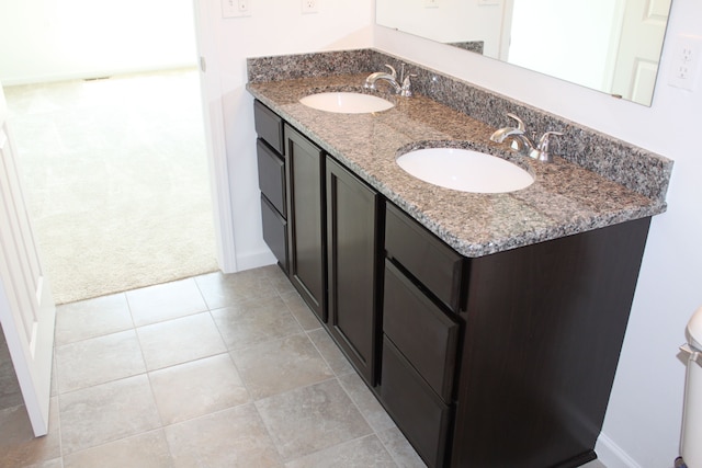 58192 Kincaid St, New Haven, MI 48048 - full bathroom with baseboards, double vanity, and tile patterned floors