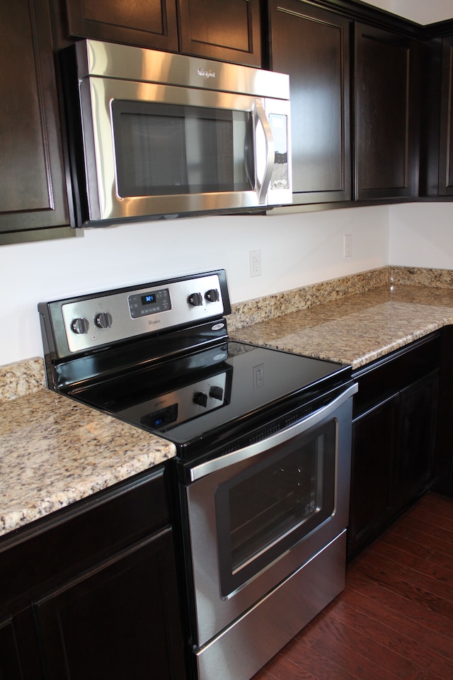 58192 Kincaid St, New Haven, MI 48048 - kitchen featuring appliances with stainless steel finishes, dark wood-style flooring, and dark brown cabinets