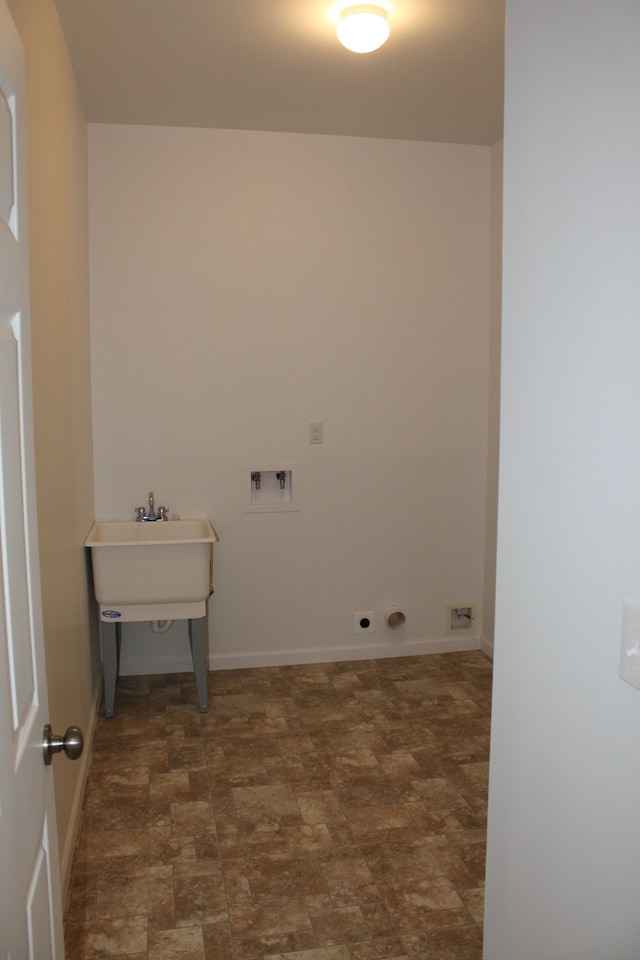 58192 Kincaid St, New Haven, MI 48048 - washroom with stone finish flooring, hookup for a washing machine, and baseboards
