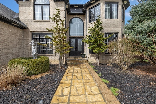 58 Ingram Dr, Troy, MI 48098 - entrance to property featuring french doors and brick siding
