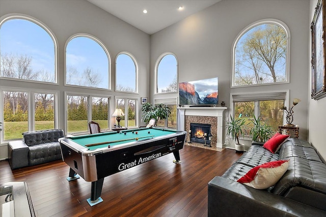 58 Ingram Dr, Troy, MI 48098 - playroom featuring a towering ceiling, billiards table, a fireplace with flush hearth, hardwood / wood-style floors, and recessed lighting