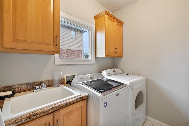 58 Ingram Dr, Troy, MI 48098 - clothes washing area featuring washing machine and dryer and cabinet space
