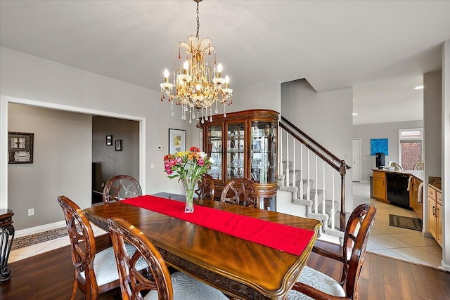 58 Ingram Dr, Troy, MI 48098 - dining area with a chandelier, stairway, and light tile patterned flooring