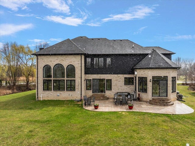 58 Ingram Dr, Troy, MI 48098 - rear view of property with brick siding, a patio area, a yard, a shingled roof, and entry steps