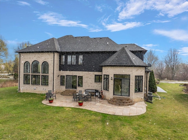 58 Ingram Dr, Troy, MI 48098 - back of house with brick siding, a patio area, a yard, and entry steps