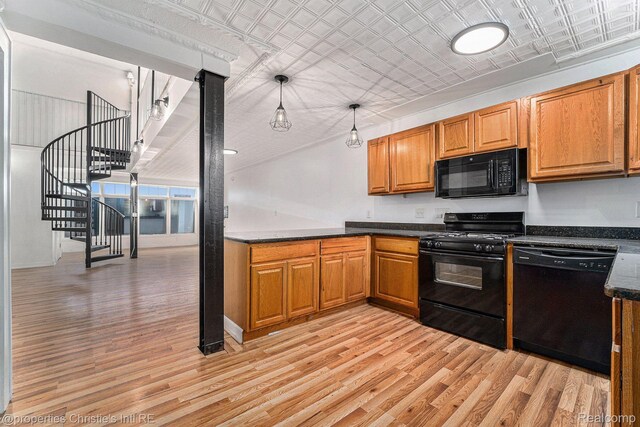 8820 Joseph Campau St Unit 2, Hamtramck, MI 48212 - kitchen with black appliances, light wood-style flooring, dark countertops, brown cabinetry, and an ornate ceiling