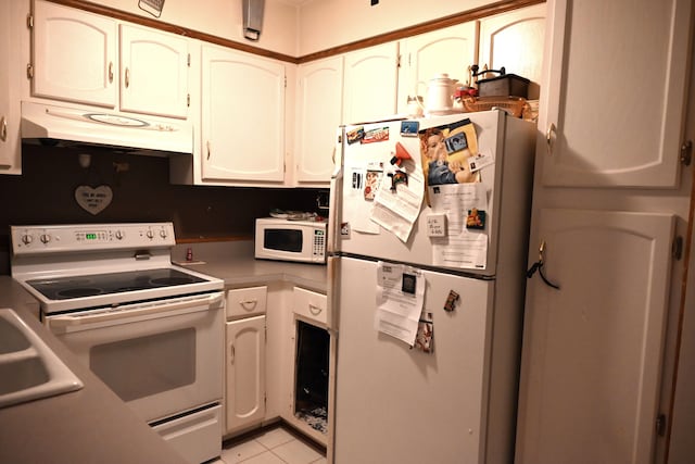 17620 Rudgate St, Southgate, MI 48195 - kitchen featuring white appliances, under cabinet range hood, light tile patterned flooring, light countertops, and a sink