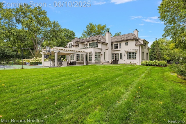 1475 Tottenham Rd, Bloomfield Hills, MI 48301 - back of property with stucco siding, a balcony, a pergola, a chimney, and a patio