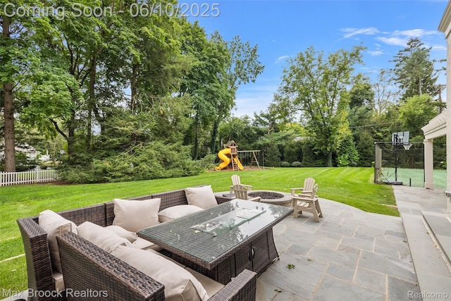 1475 Tottenham Rd, Bloomfield Hills, MI 48301 - view of patio / terrace with a playground, an outdoor living space with a fire pit, and view of wooded area
