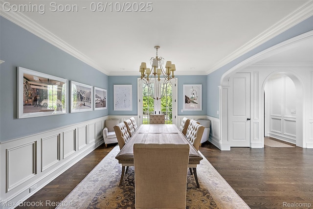 1475 Tottenham Rd, Bloomfield Hills, MI 48301 - dining space featuring a chandelier, dark wood finished floors, crown molding, a decorative wall, and a wainscoted wall