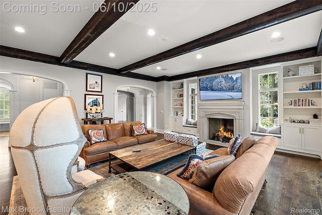1475 Tottenham Rd, Bloomfield Hills, MI 48301 - living room with arched walkways, dark wood-type flooring, decorative columns, beam ceiling, and built in features
