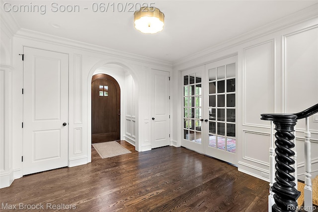 1475 Tottenham Rd, Bloomfield Hills, MI 48301 - foyer with french doors, arched walkways, plenty of natural light, dark wood-style floors, and crown molding