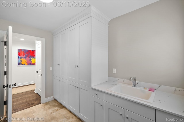 1475 Tottenham Rd, Bloomfield Hills, MI 48301 - bathroom featuring baseboards and double vanity