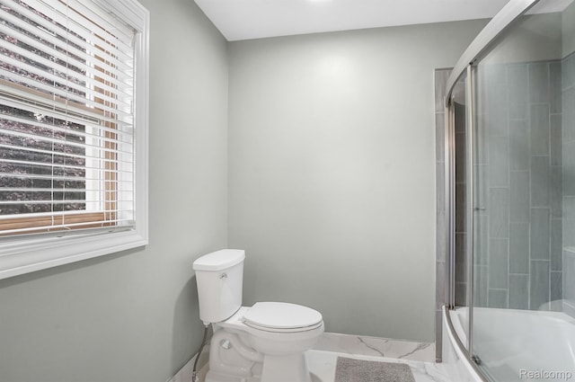 6655 Mountain Dr, Troy, MI 48098 - bathroom with plenty of natural light, toilet, combined bath / shower with glass door, and marble look tile flooring