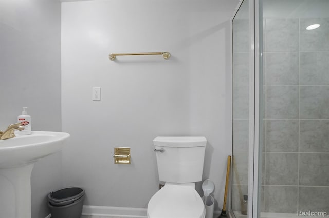 6655 Mountain Dr, Troy, MI 48098 - bathroom with toilet, a shower stall, and a sink