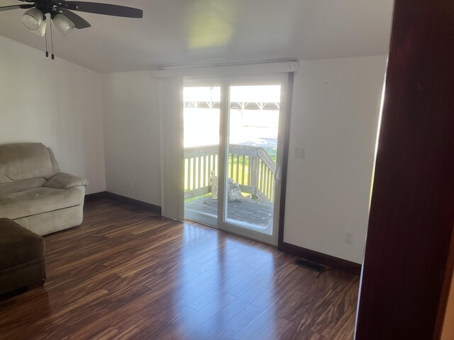 3048 Vineland Ave, Burton, MI 48519 - living area featuring ceiling fan, plenty of natural light, baseboards, and dark wood-type flooring