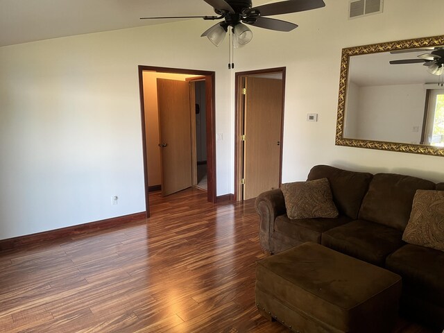 3048 Vineland Ave, Burton, MI 48519 - living room with ceiling fan, wood finished floors, baseboards, and vaulted ceiling