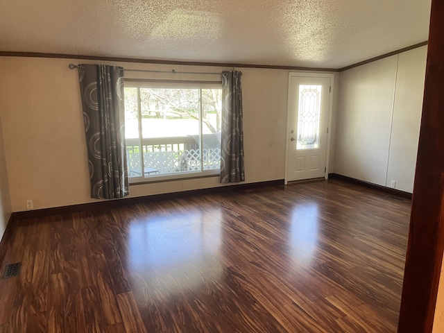 3048 Vineland Ave, Burton, MI 48519 - unfurnished room featuring crown molding, wood finished floors, a textured ceiling, and baseboards