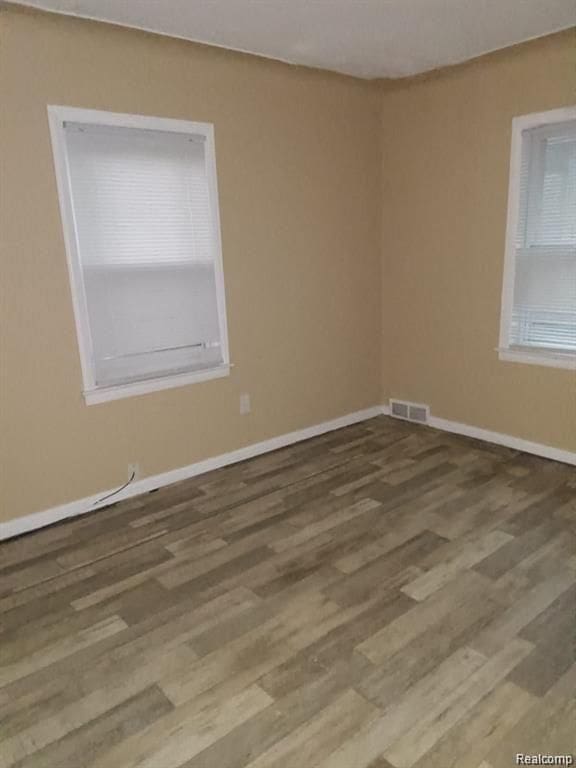 15470 Mapleridge St, Detroit, MI 48205 - spare room featuring wood finished floors and baseboards