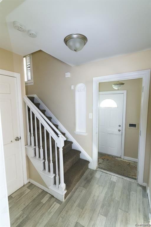 15470 Mapleridge St, Detroit, MI 48205 - foyer featuring wood finished floors, stairway, and baseboards