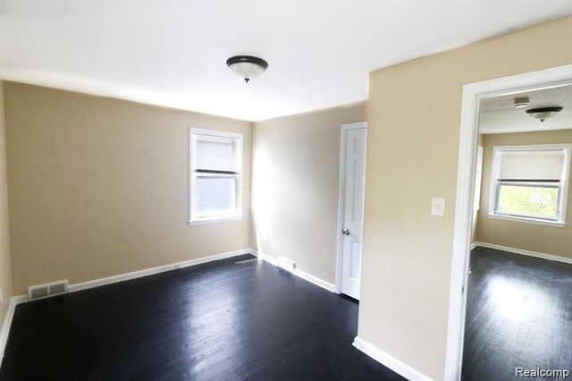 15470 Mapleridge St, Detroit, MI 48205 - spare room with dark wood-type flooring and baseboards