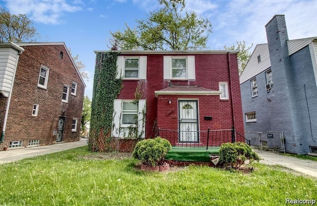 15470 Mapleridge St, Detroit, MI 48205 - view of front facade with brick siding, a front yard, and cooling unit