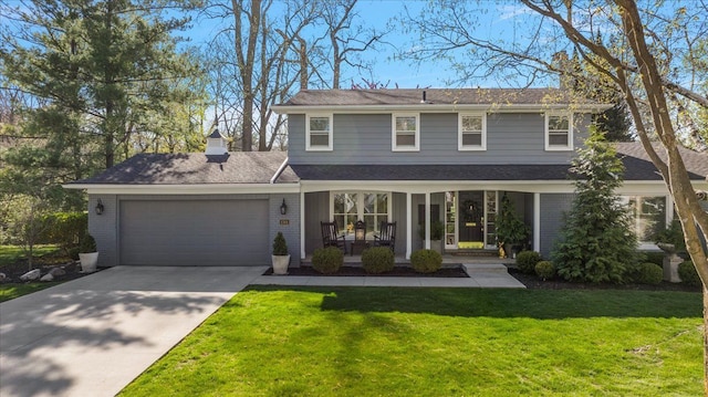 1301 Fairway Dr, Birmingham, MI 48009 - view of front of house featuring a garage, a front lawn, concrete driveway, brick siding, and a porch