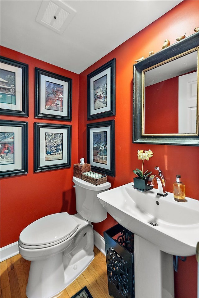1301 Fairway Dr, Birmingham, MI 48009 - bathroom featuring baseboards, toilet, and wood finished floors