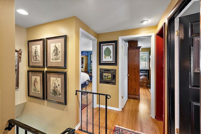 1301 Fairway Dr, Birmingham, MI 48009 - hall with light wood-style floors, baseboards, and an upstairs landing