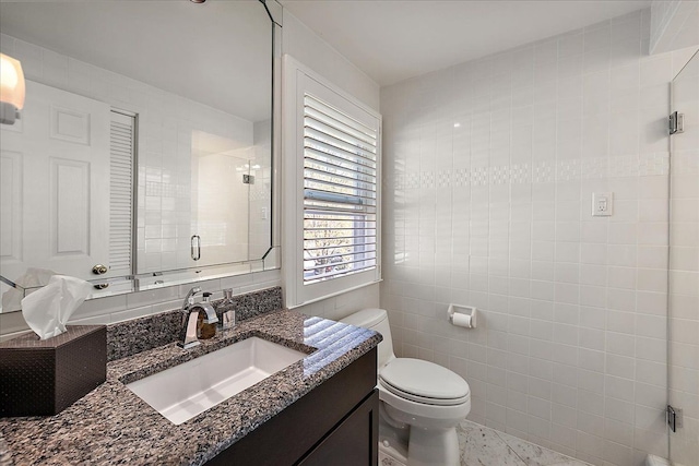 1301 Fairway Dr, Birmingham, MI 48009 - bathroom featuring a stall shower, toilet, vanity, and tile walls