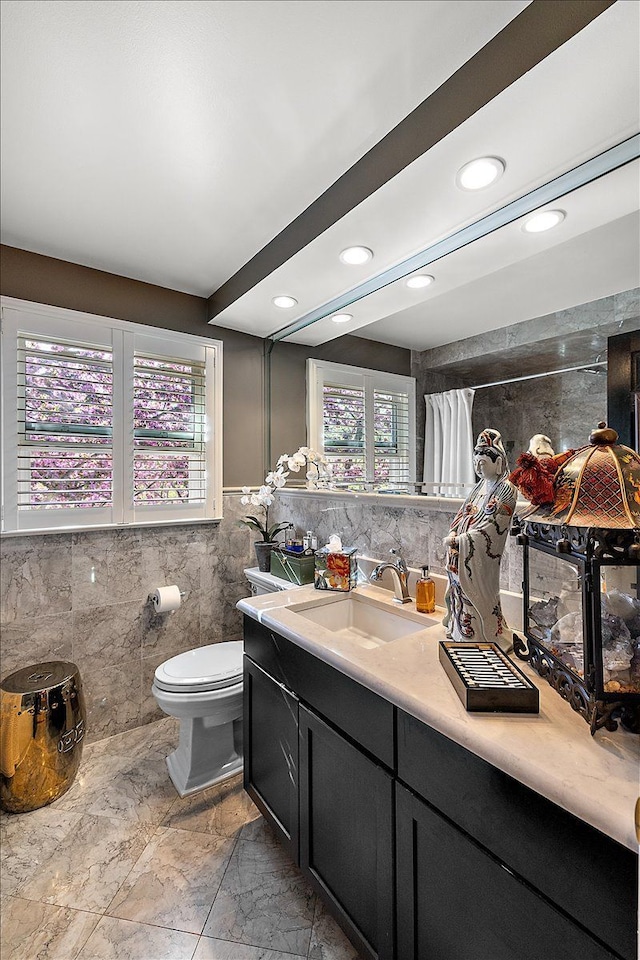 1301 Fairway Dr, Birmingham, MI 48009 - full bath featuring tile walls, marble look tiles, toilet, recessed lighting, and vanity