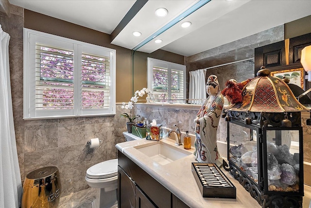1301 Fairway Dr, Birmingham, MI 48009 - bathroom with tile walls, toilet, vanity, a shower with shower curtain, and recessed lighting