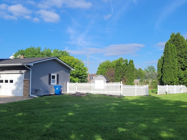 view of yard with an attached garage