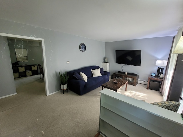 living area featuring light colored carpet, baseboard heating, and baseboards